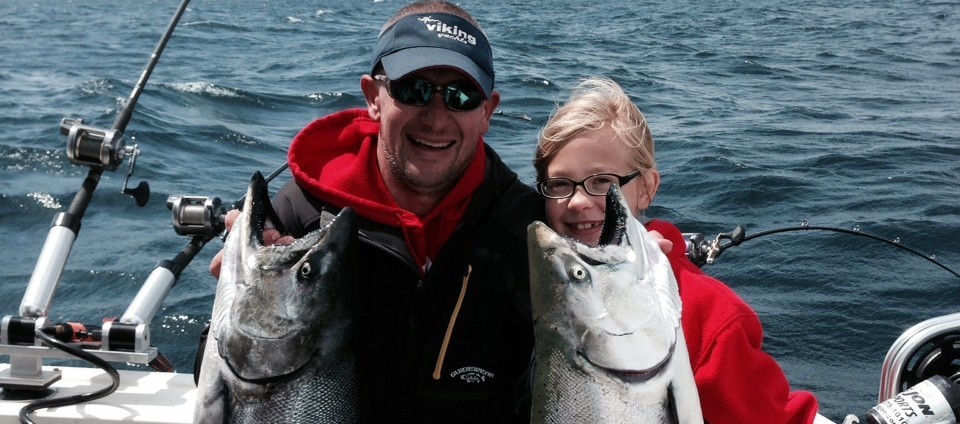 Captain Scott Gutschow is sharing his Lake Michigan chartering experience with his daughter Greta.